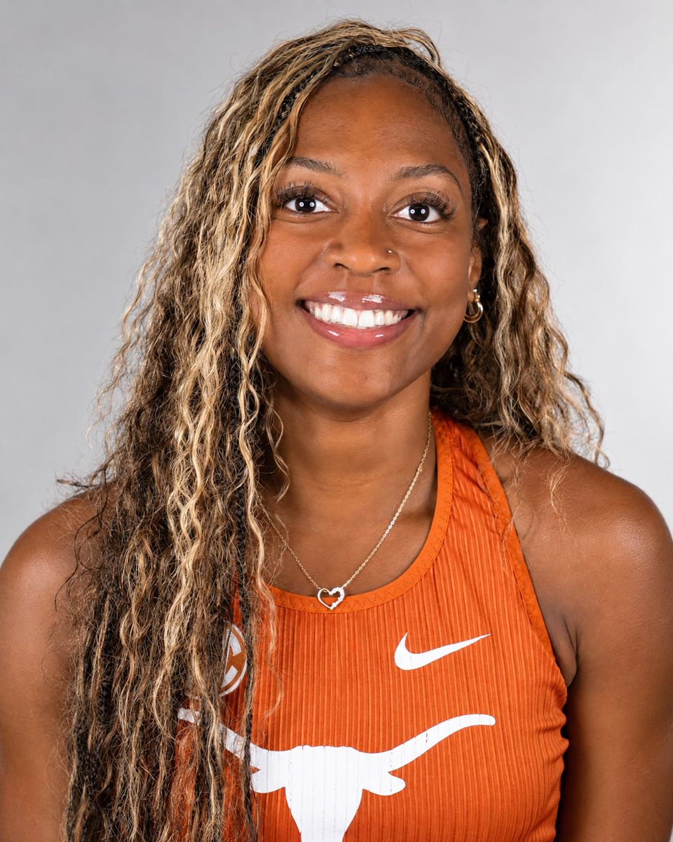 McKale Lee smiling in a burnt orange Texas Longhorns uniform